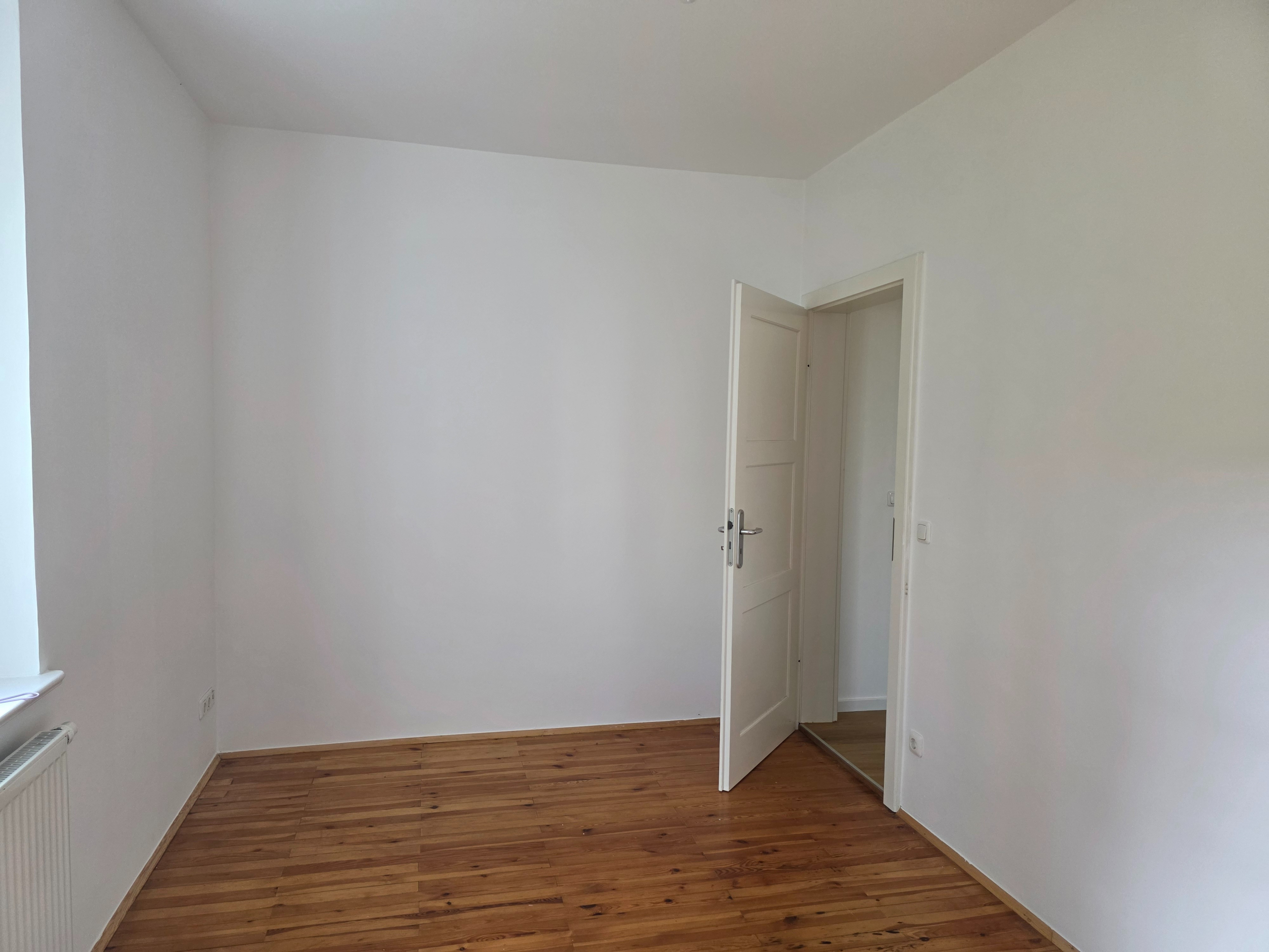 Familien-Wohnung im Herzen von Ottobrunn - Zimmer 2 Rückseite